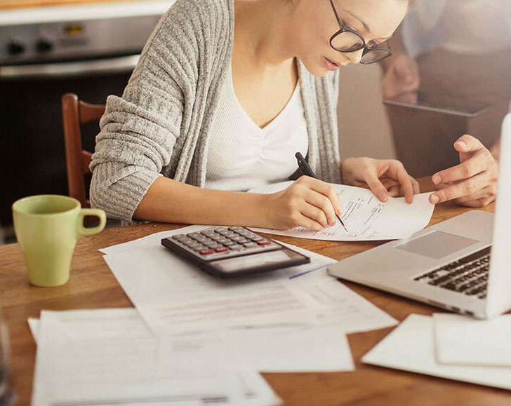 Young couple reviewing a quote for the sale of their structured settlement payments