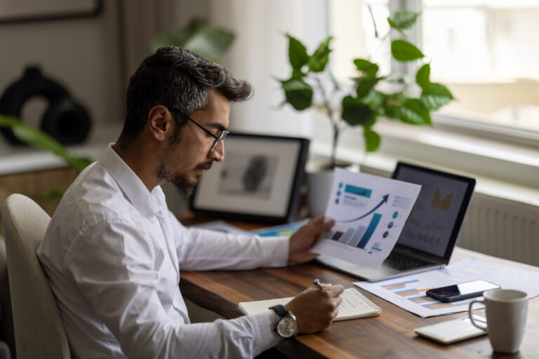 Man looking into purchasing an annuity at desk